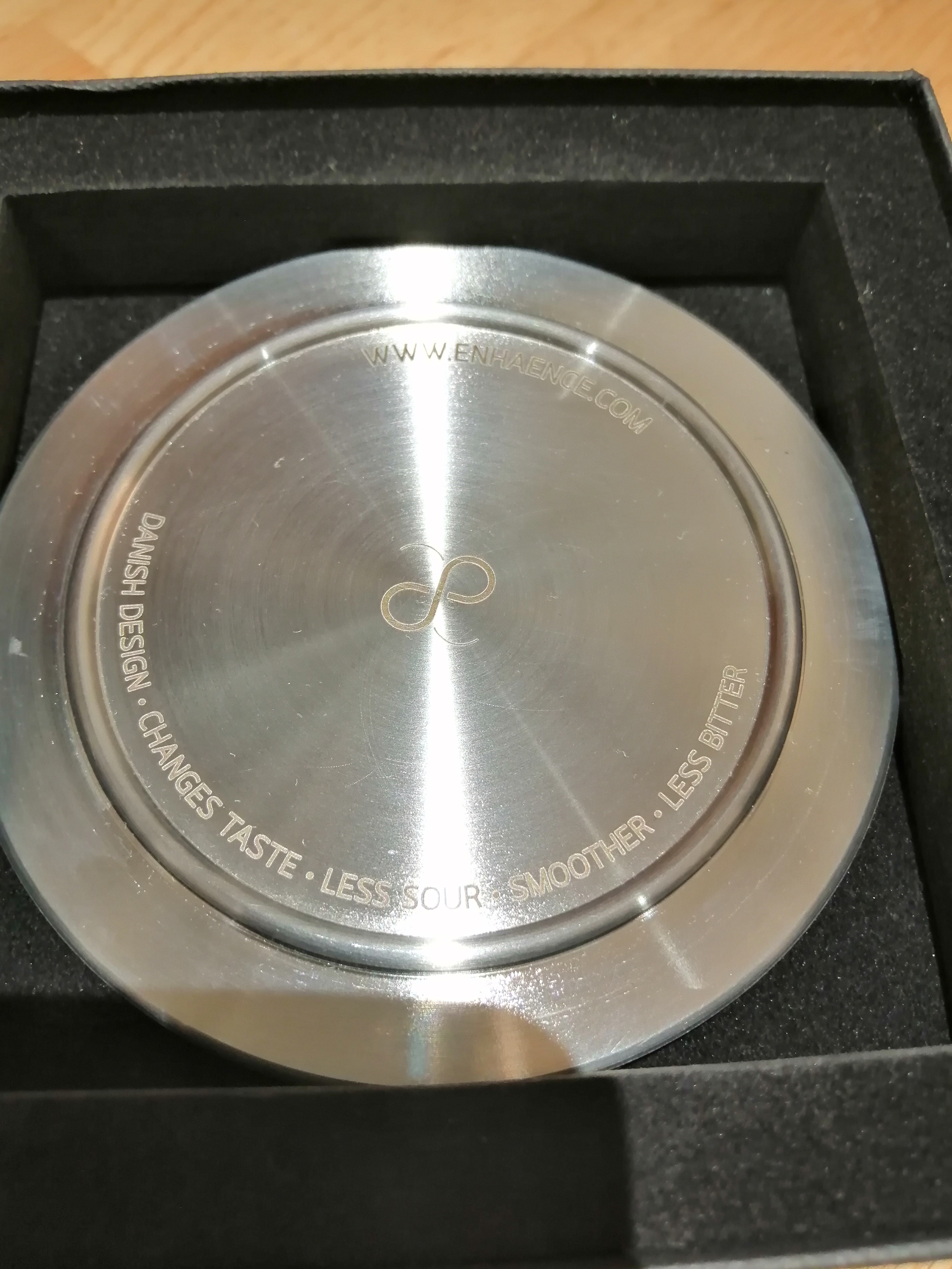 Power Plate, made of Stainless steel and designed as a table coaster with a diameter of 9 cm